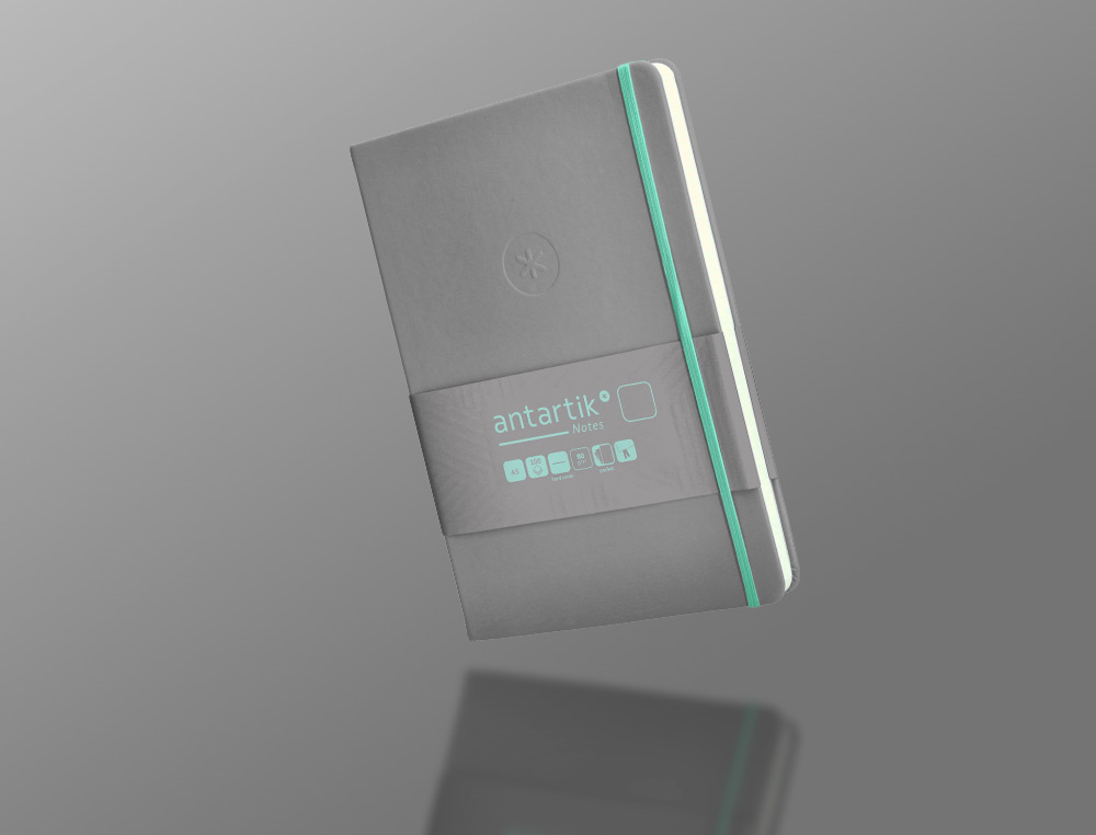 CADERNO COM ELASTICO ANTARTIK NOTES CAPA DURA A5 LISO CINZA E TURQUESA 100 FOLHAS 80 GR FSC