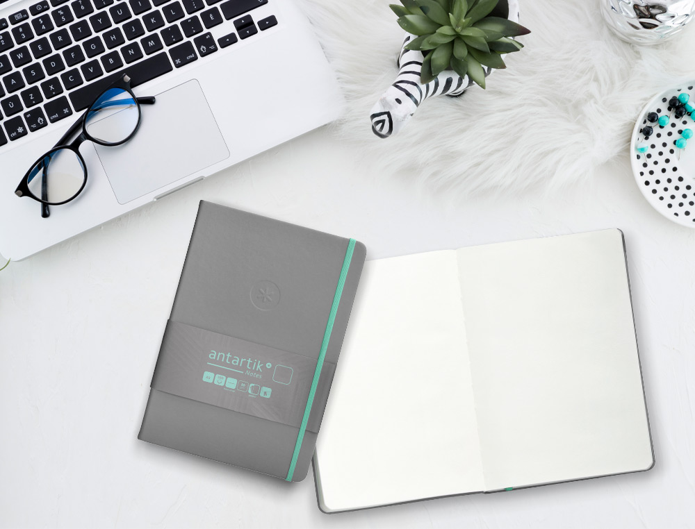 CADERNO COM ELASTICO ANTARTIK NOTES CAPA DURA A5 LISO CINZA E TURQUESA 100 FOLHAS 80 GR FSC