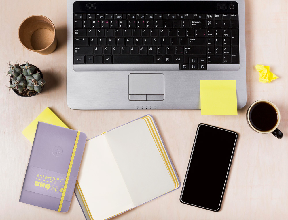CADERNO COM ELASTICO ANTARTIK NOTES CAPA DURA A6 LISO ROXO E AMARELO 100 FOLHAS 80 GR FSC